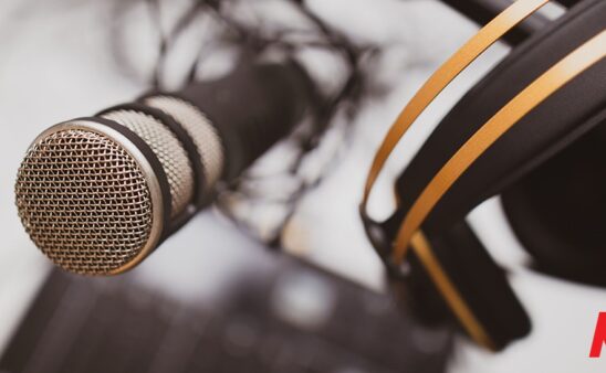 podcast - photo of microphone with KQEN logo